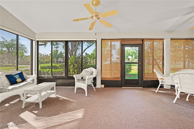 sunroom / solarium featuring ceiling fan