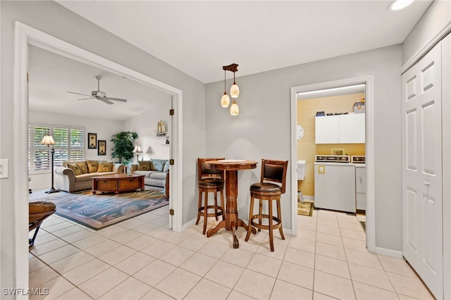 dining area featuring ceiling fan and light tile patterned floors