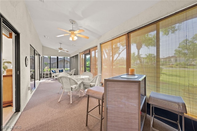 sunroom / solarium with vaulted ceiling and ceiling fan