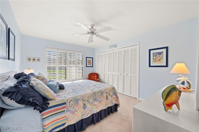 bedroom with ceiling fan, a closet, and light carpet