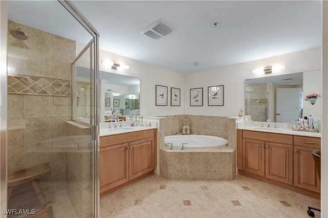 bathroom with vanity, shower with separate bathtub, and tile patterned flooring