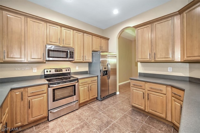 kitchen with stainless steel appliances and tile patterned floors