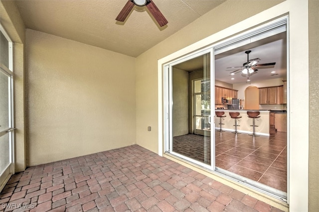 view of patio / terrace with ceiling fan