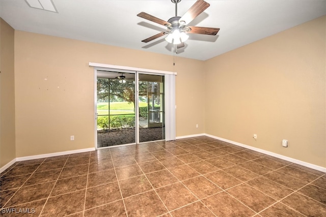 tiled empty room with ceiling fan