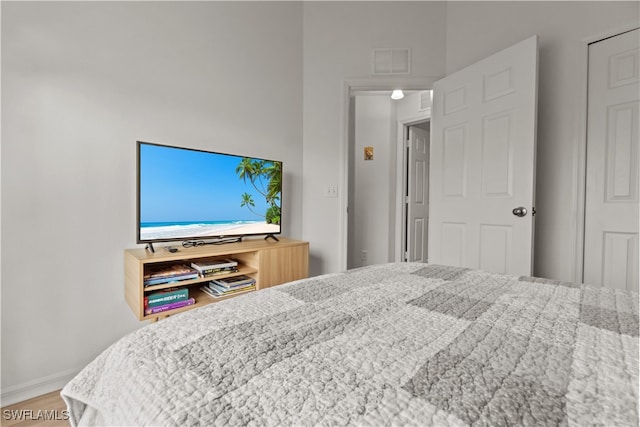 bedroom with wood-type flooring