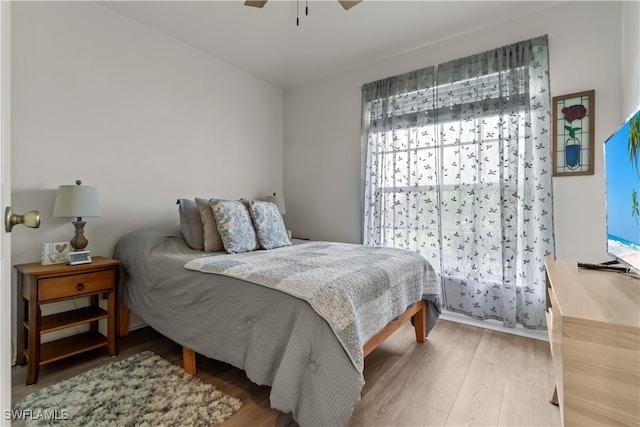 bedroom with hardwood / wood-style floors and ceiling fan