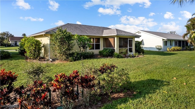 view of front of home with a front lawn