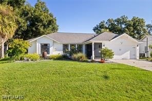 ranch-style house featuring a front yard and a garage