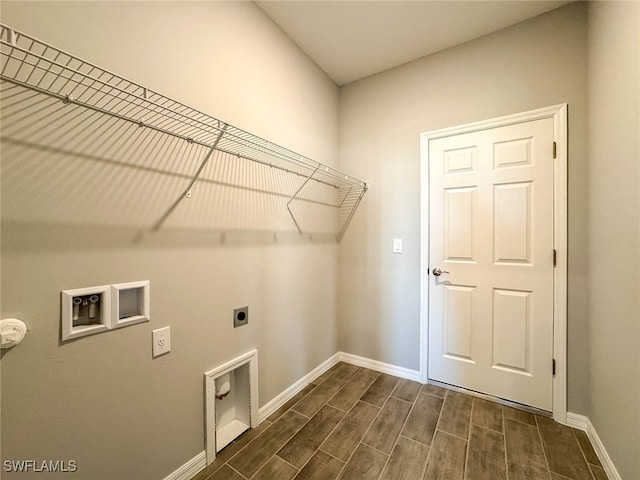 laundry room with washer hookup, dark hardwood / wood-style flooring, and electric dryer hookup