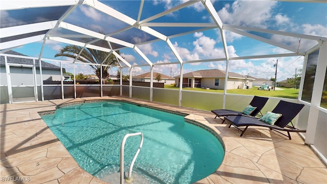 view of pool with a lanai and a patio area