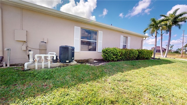 view of property exterior with a yard