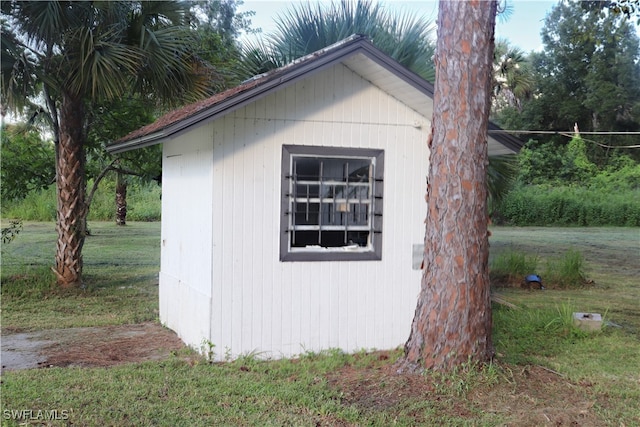 view of outbuilding with a lawn