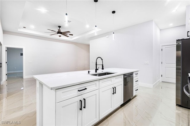 kitchen featuring sink, white cabinetry, stainless steel appliances, and hanging light fixtures