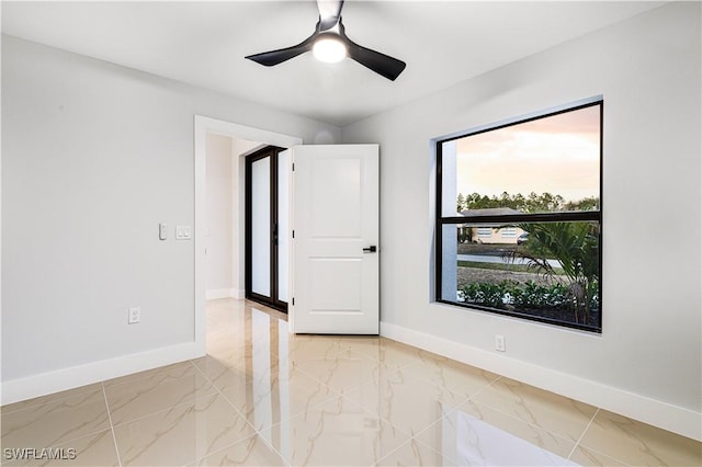 empty room featuring ceiling fan