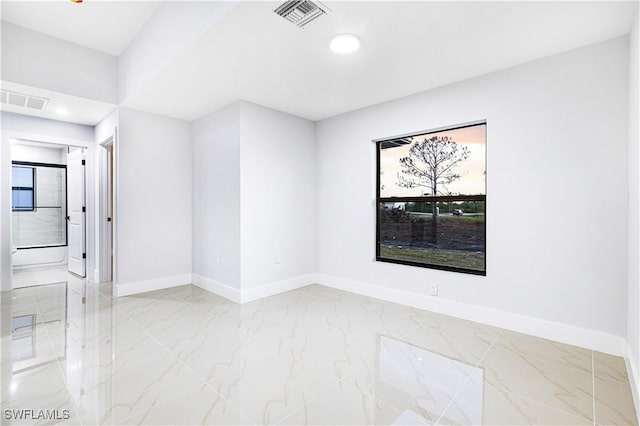 spare room featuring plenty of natural light