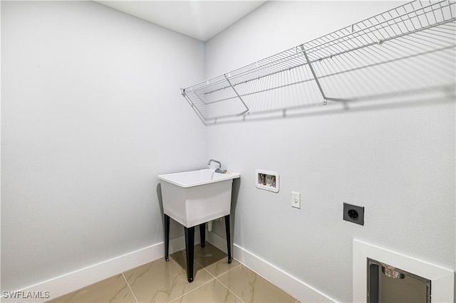 clothes washing area featuring washer hookup and electric dryer hookup