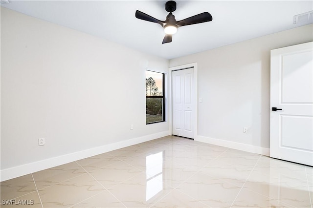 interior space featuring ceiling fan