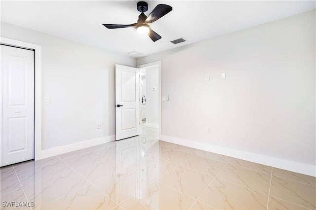 unfurnished bedroom with a closet and ceiling fan