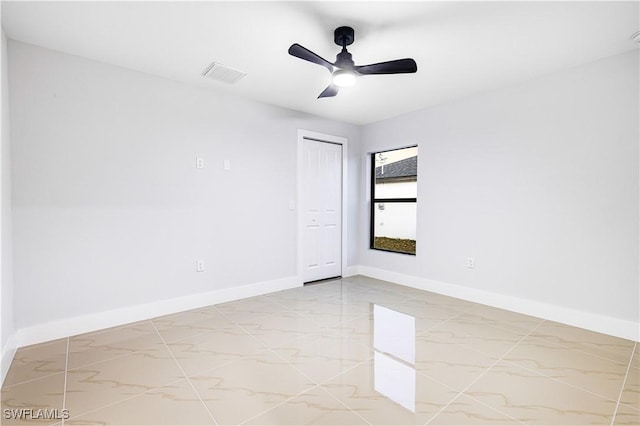 empty room featuring ceiling fan