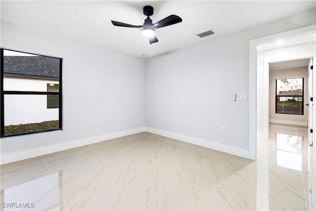 unfurnished room with ceiling fan