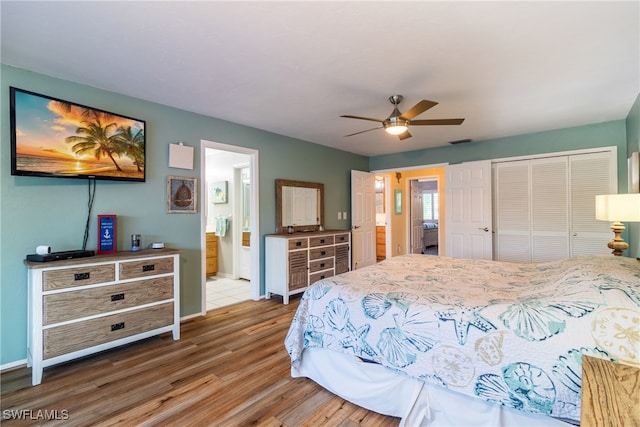 bedroom featuring ensuite bathroom, hardwood / wood-style floors, and ceiling fan