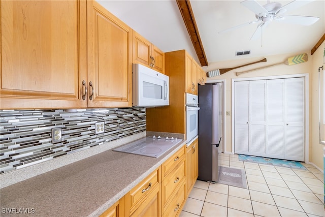 kitchen with tasteful backsplash, light tile patterned floors, ceiling fan, vaulted ceiling with beams, and white appliances