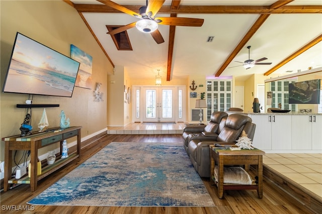 living room featuring dark hardwood / wood-style floors and beam ceiling