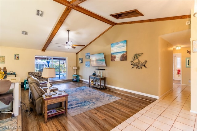 living room with ceiling fan, high vaulted ceiling, beamed ceiling, and light wood-type flooring