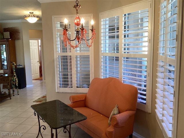 sitting room featuring light tile patterned floors, crown molding, and an inviting chandelier