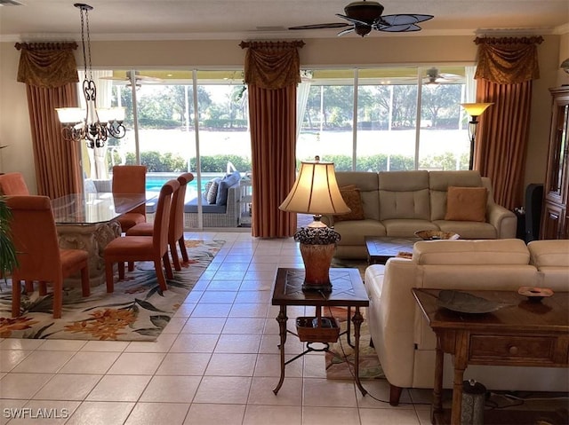 tiled living room featuring ceiling fan with notable chandelier and crown molding