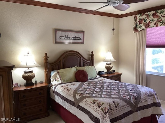 bedroom with ceiling fan and ornamental molding