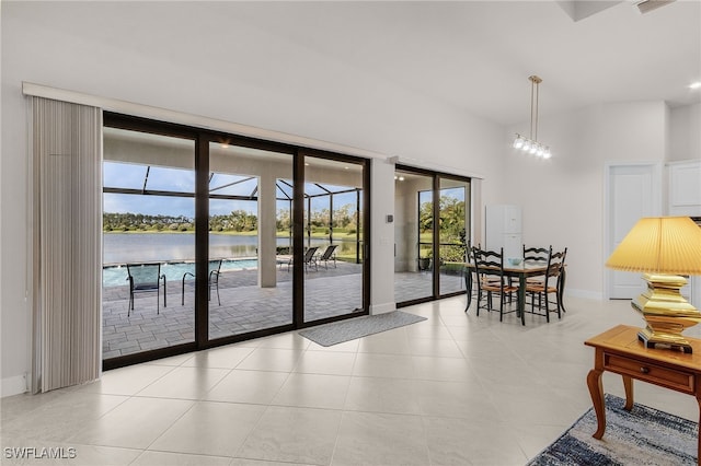 entryway with a water view and light tile patterned flooring