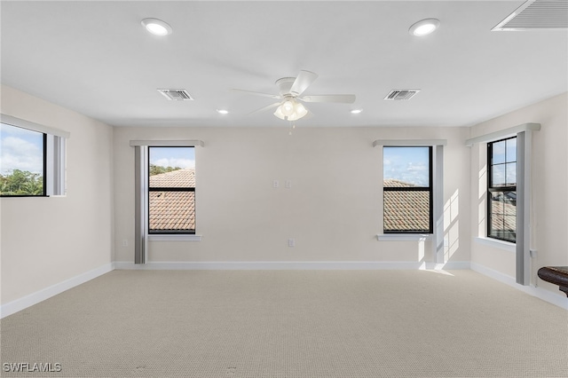 carpeted empty room with ceiling fan