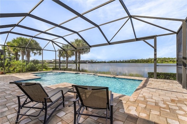 view of pool featuring pool water feature, a patio area, a lanai, and a water view