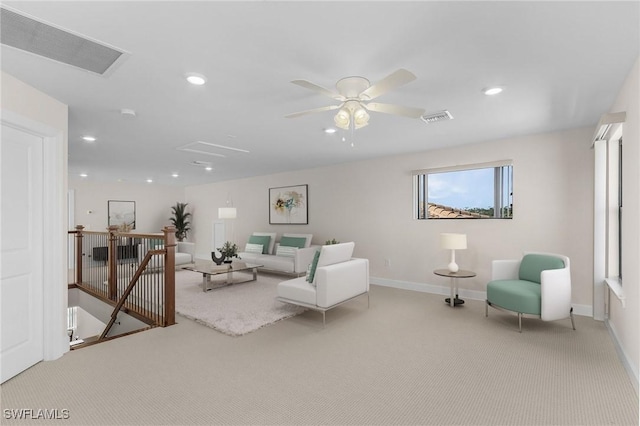 carpeted living room featuring ceiling fan