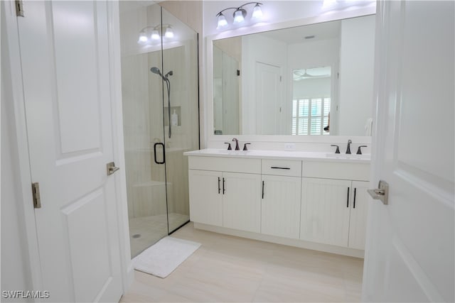 bathroom featuring walk in shower and vanity