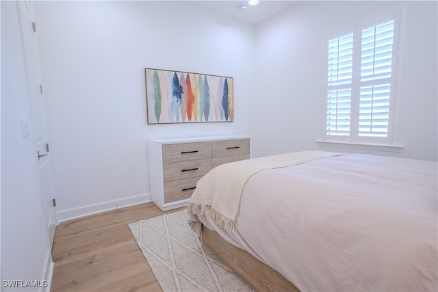 bedroom with light wood-type flooring