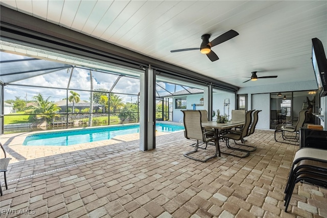 view of pool with a patio area, a lanai, and ceiling fan