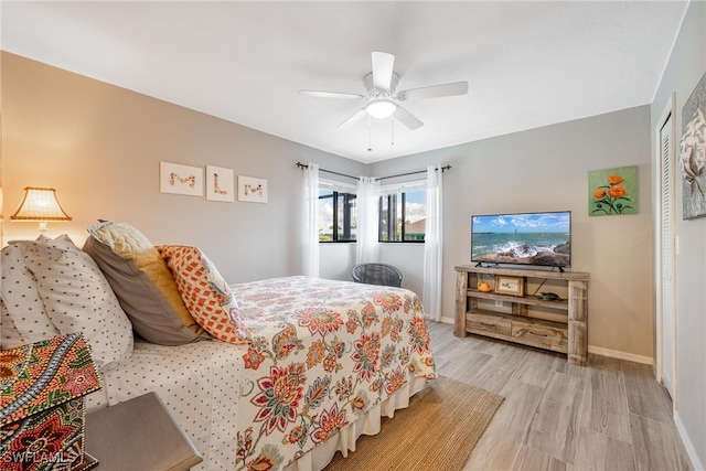 bedroom featuring light hardwood / wood-style floors and ceiling fan