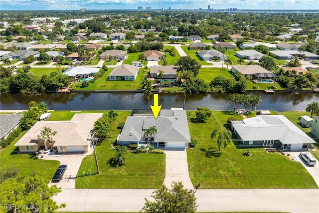 birds eye view of property featuring a water view