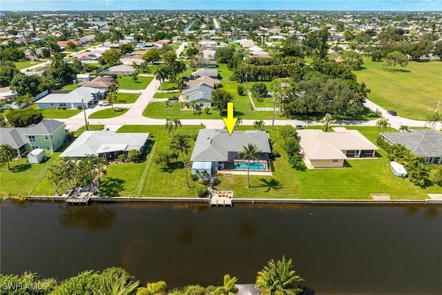 birds eye view of property featuring a water view