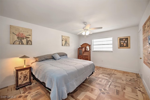 bedroom featuring ceiling fan and light parquet floors