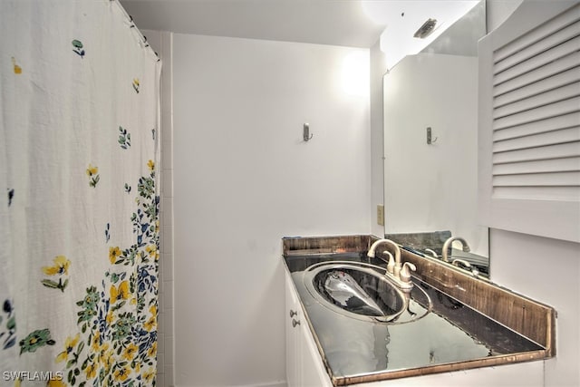 interior space with walk in shower and vanity