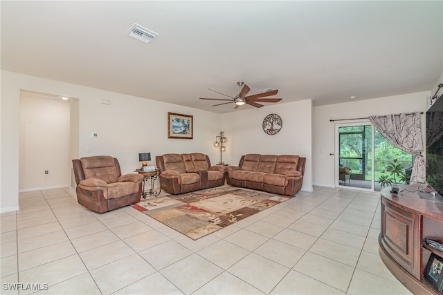 tiled living room featuring ceiling fan