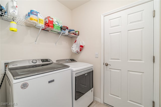 laundry room with independent washer and dryer