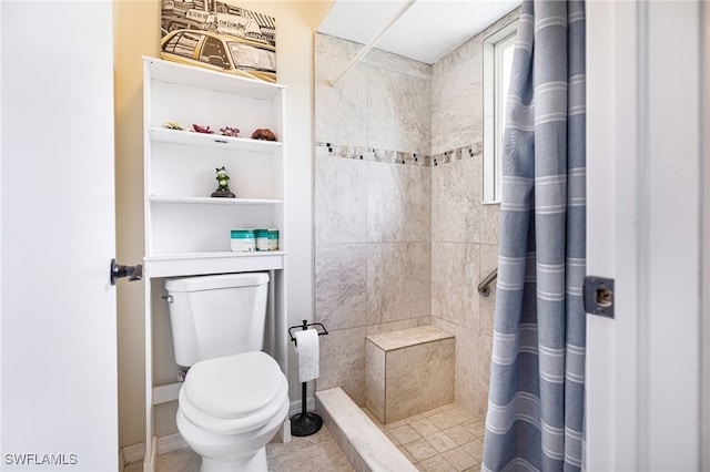 bathroom with toilet, tile patterned flooring, and a shower with shower curtain