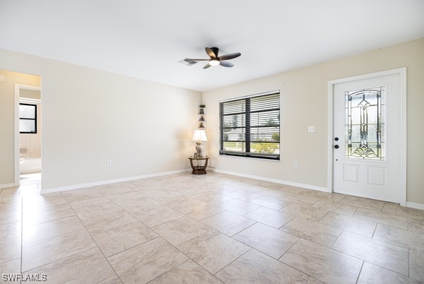 foyer featuring ceiling fan