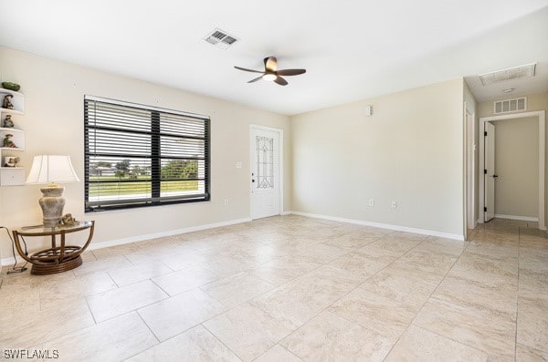 unfurnished room with ceiling fan