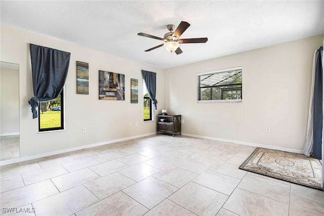 unfurnished room with ceiling fan