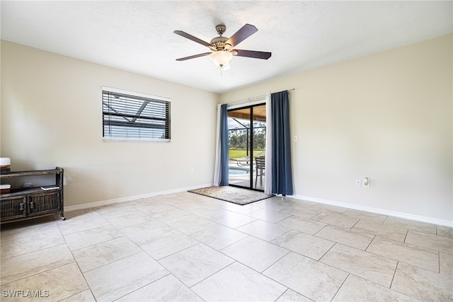 unfurnished room featuring ceiling fan